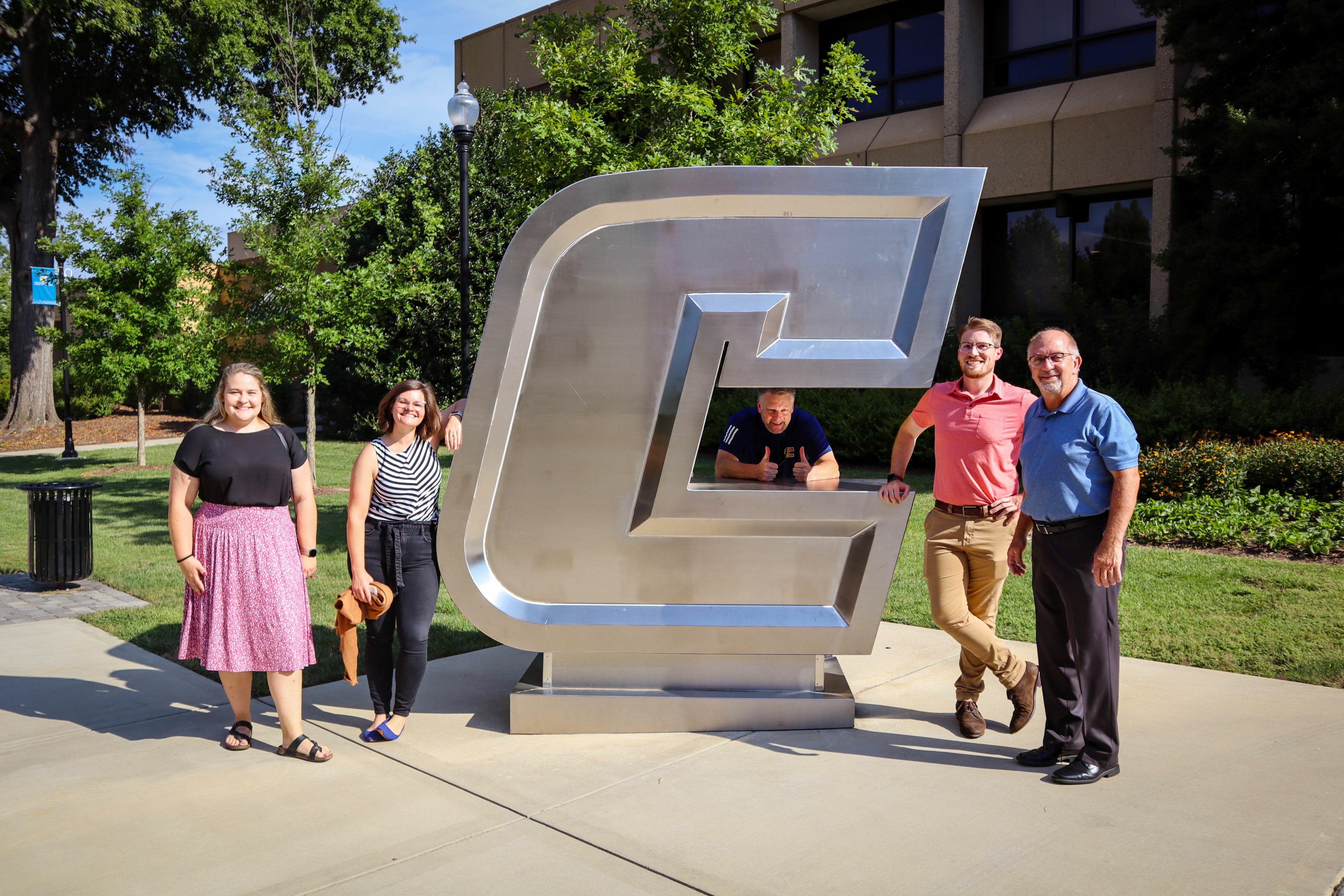 The RSC team poses with Dr. Allen Pratt (pictured center) and NREA President Dave Ardrey on UTC's Campus.