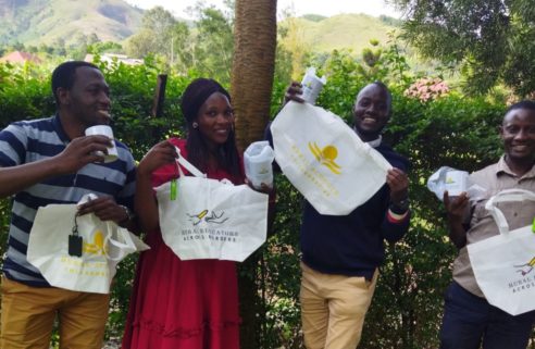 Teachers in Uganda holding RSC bags