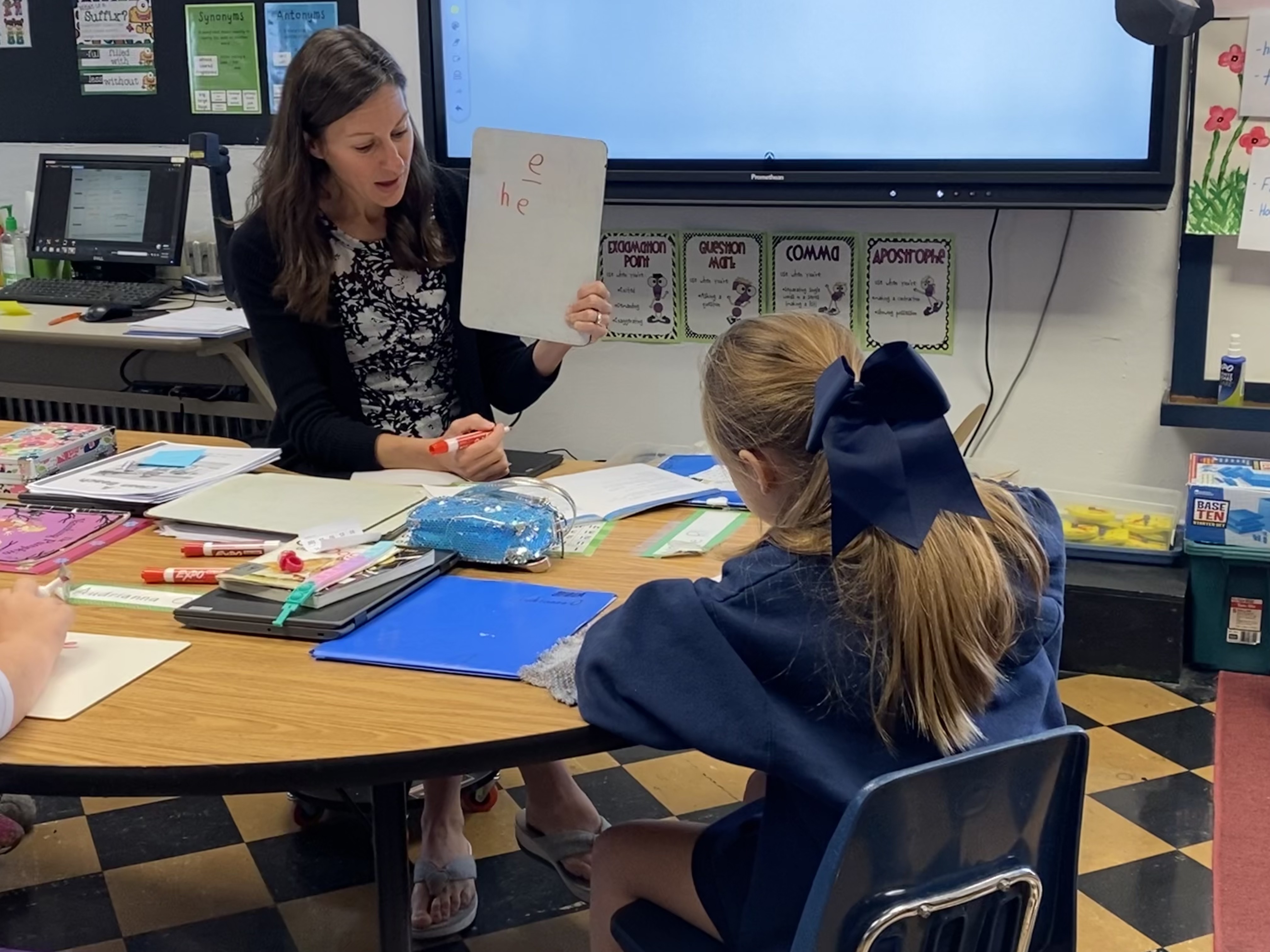Suzy working with students in her classroom